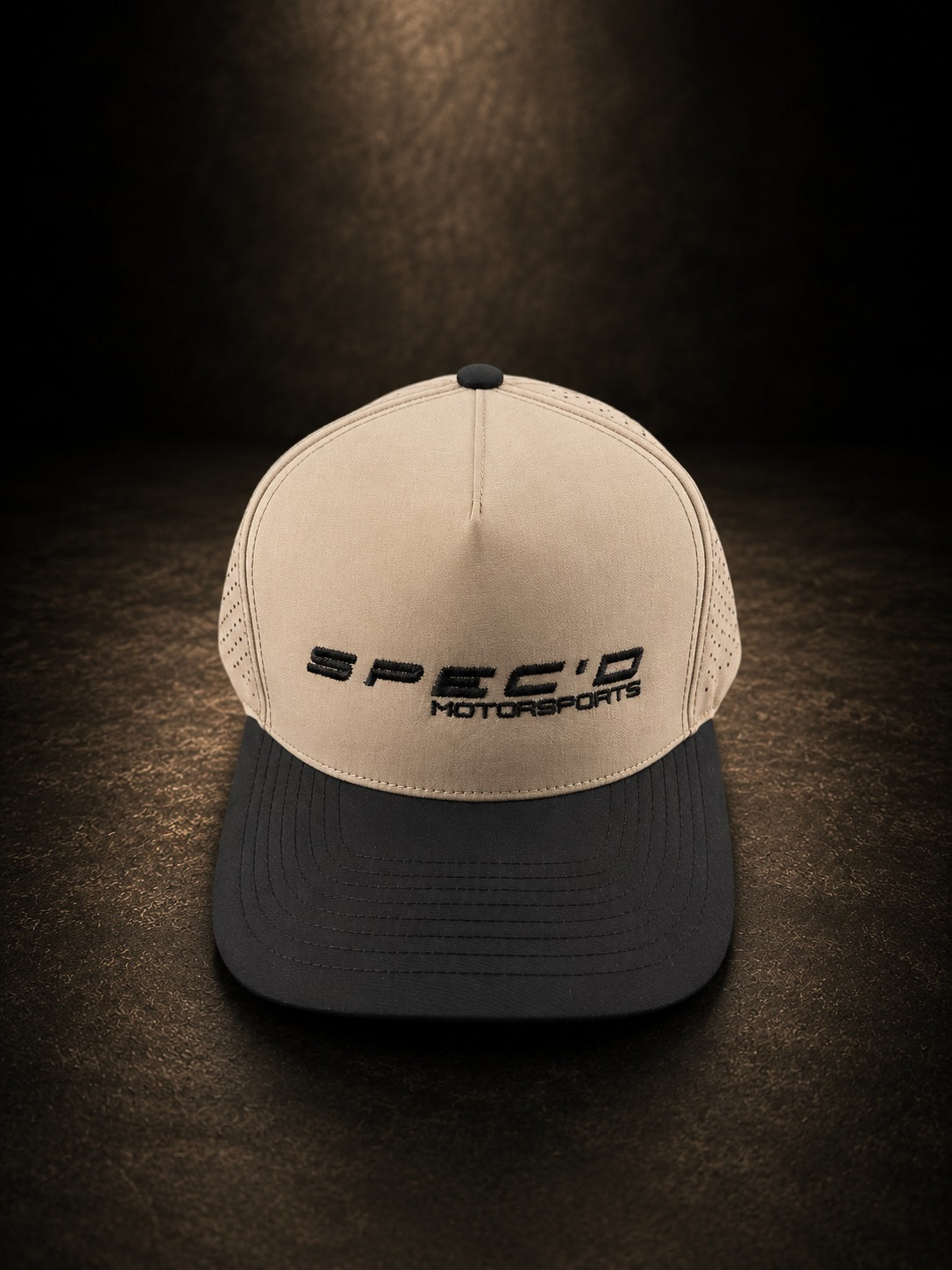 Beige and black cap with 'SPEC'D MOTORSPORTS' logo on a dark background