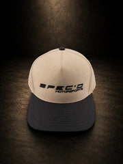 Beige and black cap with 'SPEC'D MOTORSPORTS' logo on a dark background
