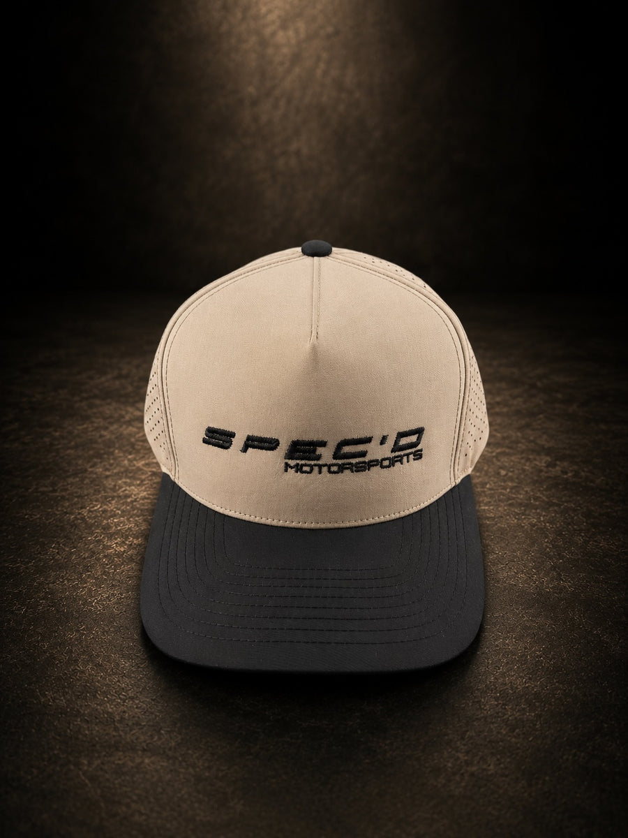 Beige and black cap with 'SPEC'D MOTORSPORTS' logo on a dark background